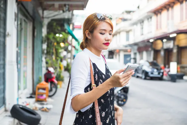 asian girl holding a phone on categories